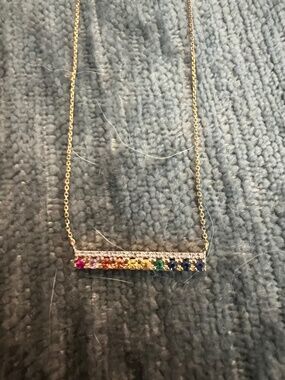 14 karat yellow gold diamond and gemstones necklace